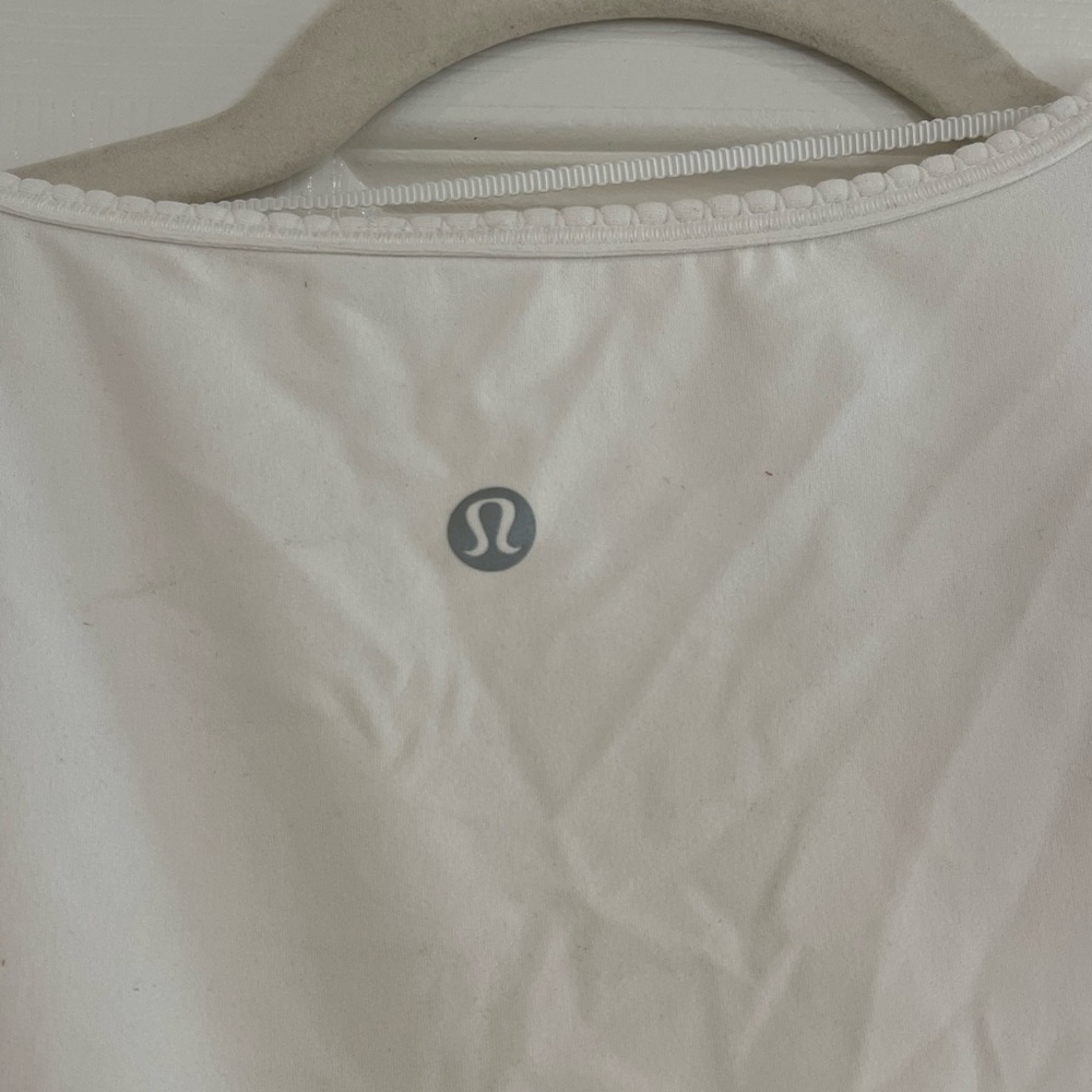 White LuluLemon wrap top. Never worn.